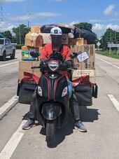 thai-motorcycle-delivery-rider-boxes-galore-on-his-bike-v0-h192v3wlw7eb1.jpg