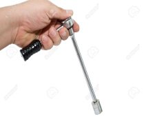 15192505-a-worker-holding-a-13-mm-socket-ratchet-ready-to-work[1].jpg
